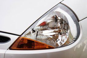 headlight of a white car close-up