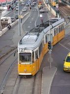 long tram on street in city, hungary, budapest