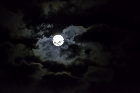 bright moon in a black sky