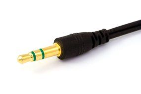 black cable with a gold plug on white