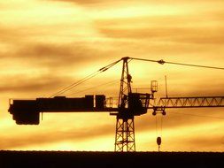 crane against the yellow sky