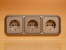 three sockets on the wall