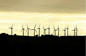 Silhouettes of wind turbines as a graphic image