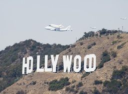 space shuttle over the Hollywood sign