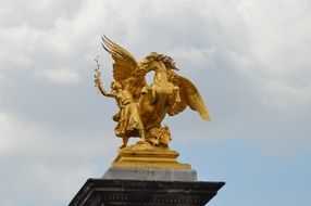 golden historical statue in paris
