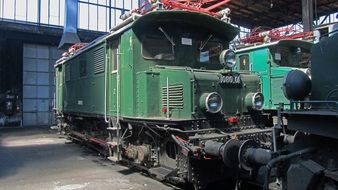 electric locomotive on the railway tracks at the station