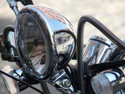 silver spotlight on a motorcycle