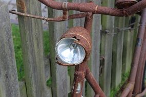 Rusty bicycle with lamp