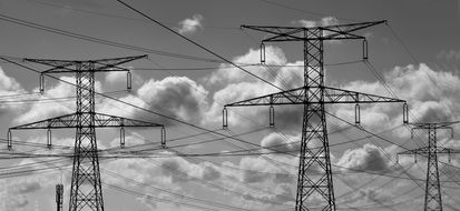 black and white photo of electrical wiring on poles