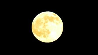 Full yellow moon in the sky