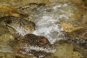 river flow on among stones