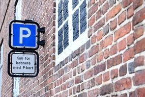 parking space near the brick wall