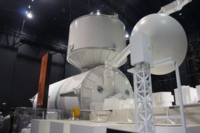 white spaceship in a big hangar, Japan