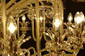 detail of crystal chandelier with light bulbs