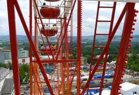part of ferris wheel above city, germany, kassel