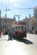 Electric tram on the street in old city
