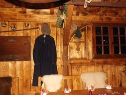 sheep skins on a bench in a wooden rural house