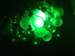 many green bulbs in the dark