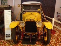 yellow oldtimer aautomobile in historical museum