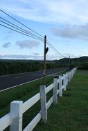 white wooden fence near the road