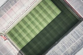 top view of a stadium with a green field