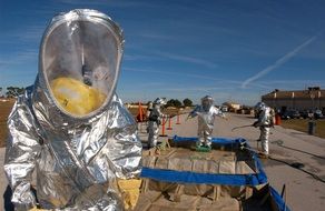 people in hazmat suits