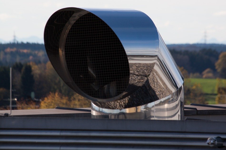 new metal ventilation pipe on roof close-up