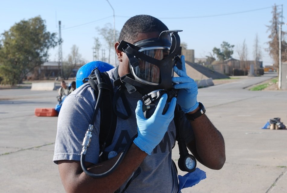 african american is wearing gas mask