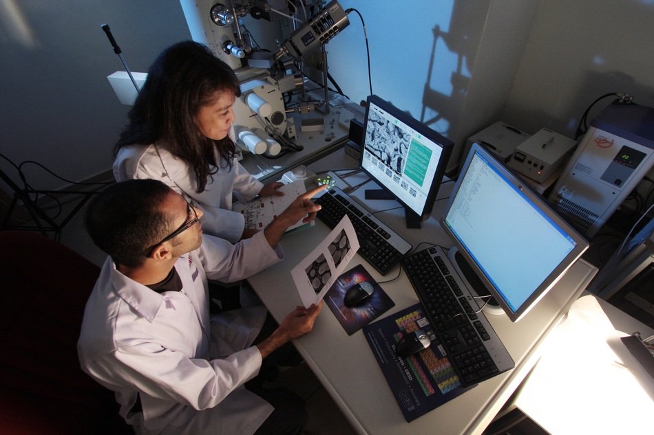 man and woman at work in research laboratory