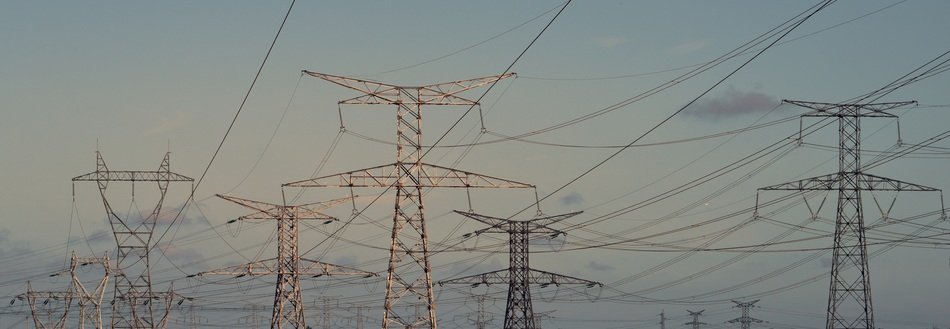 many electric pylons against the sky