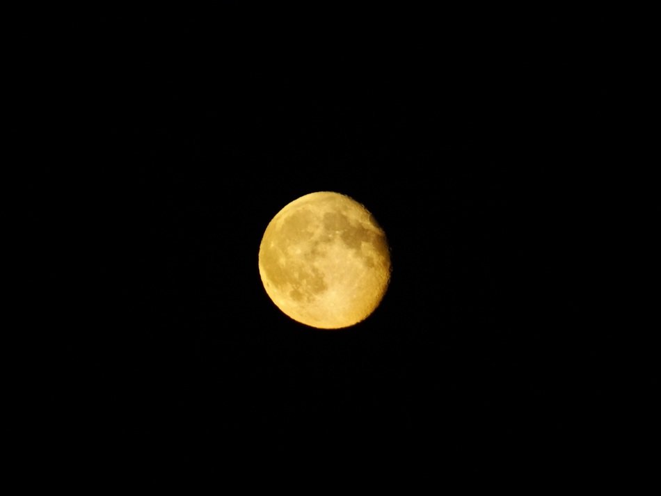 photo of lighting moon in the darkness