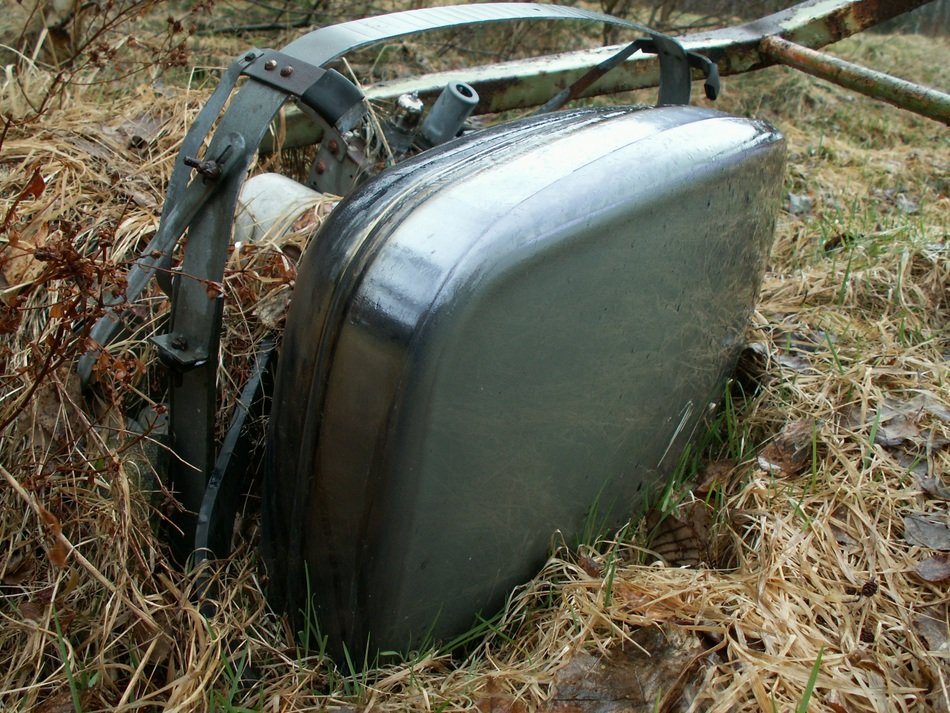 Old broken televisor in grass