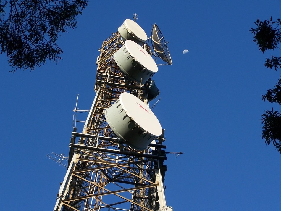 communcations devices on tower at sky
