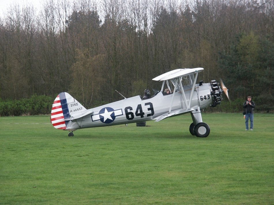 light aircraft on green grass