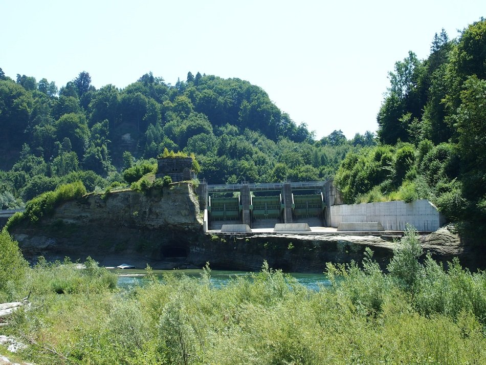 power plant among green trees