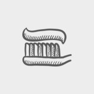 Toothbrush with toothpaste sketch icon