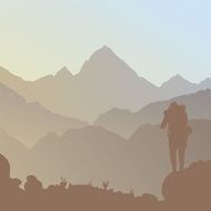 Silhouette of mountains and a tourist