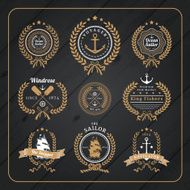 Vintage nautical wreath labels set on dark wood background