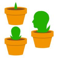 Green mans head growing in a flowerpot