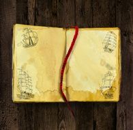 Old book with ship silhouettes