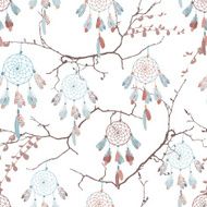 Dream catchers on the bare branches seamless vector pattern