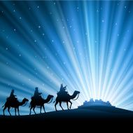 Three wise men silhouetted against starry sky