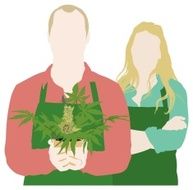 Smiling couple holding marijuana plant
