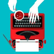 Woman typing on a vintage typewriter and holding cup