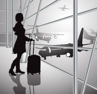passenger with luggage in airport