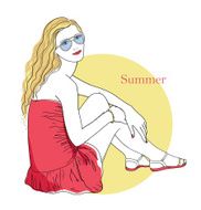Girl is sitting at sunset