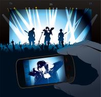 Concert with Rock Singer projected in smartphone screen N2