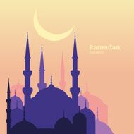 Ramadan Kareem greeting card with silhouette of mosque and moon