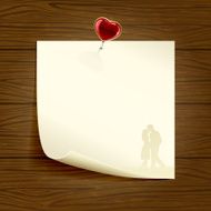 Paper with heart on wooden background
