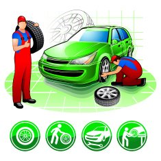 Two car mechanic changing wheel in auto repair shop